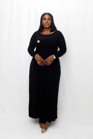 Long sleeve maxi dress with a gold brooch